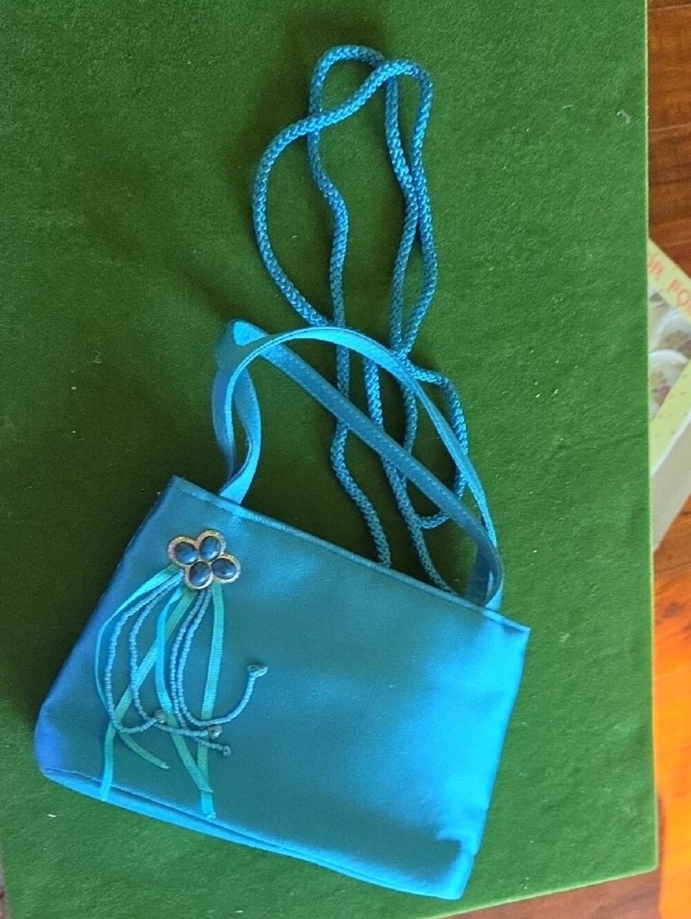 La Regale Teal Blue Crossbody Bag with Floral Charm